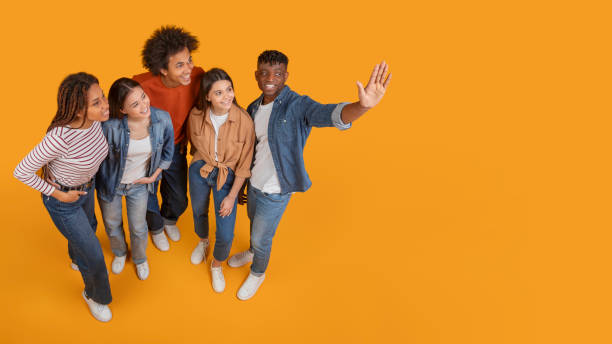 istock Friends walking and taking a selfie with a smile 2157722421