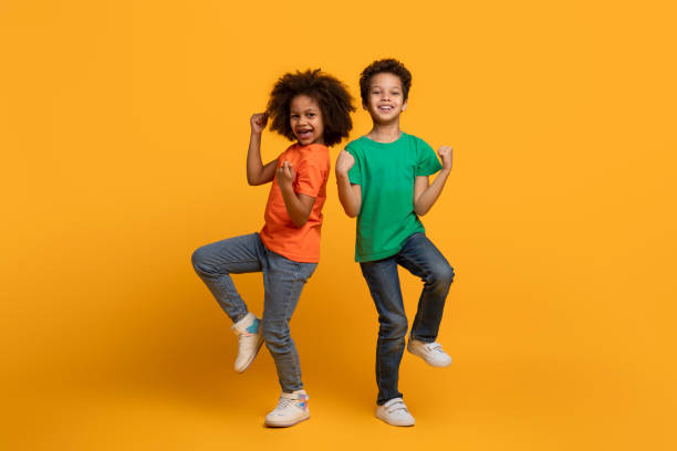 istock Two Young Children Jumping in the Air 2157722630