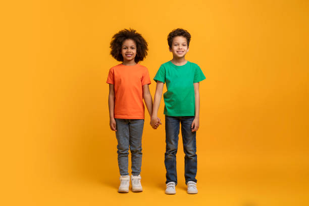 istock Two African American Kids Standing Together, Holding Hands 2157722639