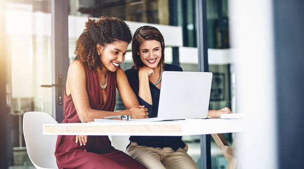 istock Computer, happy team and business women planning, discussion or brainstorming creative ideas in startup office. Laptop, smile or collaboration on project strategy, meeting or editor training online 2157723780