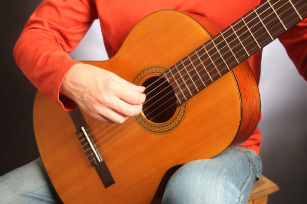 istock Acoustic guitar player spanish guitarist close up 2157728035