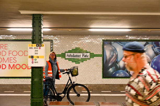 Berlin, Germany, April 27, 2024 - Passengers waiting for the subway at Potsdamer Platz station