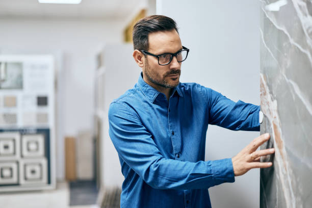 istock Focused man searching for a kitchen worktop, at the home designs shop. 2157728664