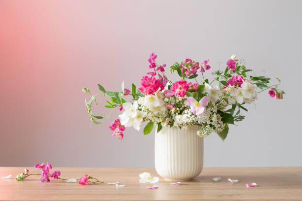 istock summer flowers in ceramic cup on light background 2157729561