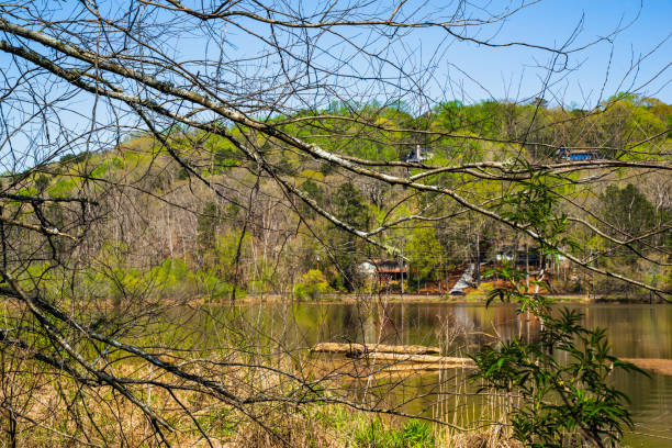 Enjoying nice weather at Roswell Riverwalk Boardwalk, a 7-mile off-road path that runs along the Chattahoochee River in Roswell, Georgia, north of Fulton County. It provides a walking path along the river. People can walk their pets on the path, but they cannot use a motorized vehicle.