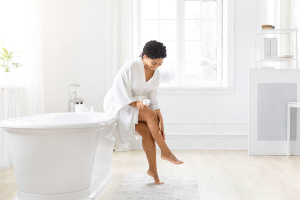 istock Woman touching her leg in a luxurious bathroom 2157729795