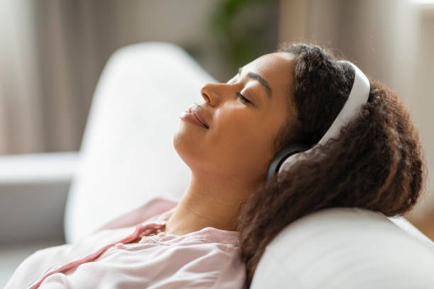 istock Serene African American woman resting on couch 2157730070