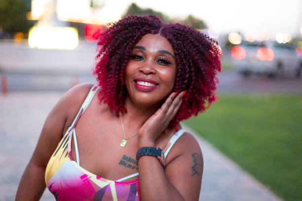 istock A smiling young woman at the downtown district 2157730455
