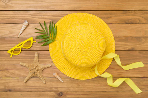 istock Yellow hat on concrete background, top view. Summer concept 2157730671