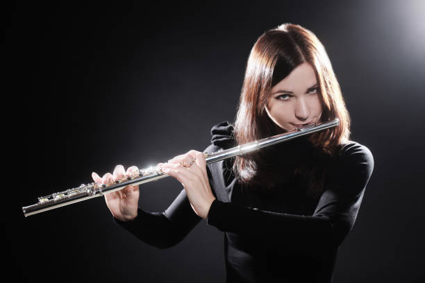 Flutist playing flute music instrument player