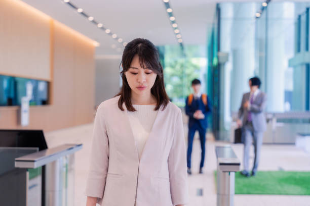 istock A woman coming to the office with a sad face 2157736187