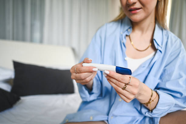 istock Close up of a woman's hand with pregnancy test. 2157736413