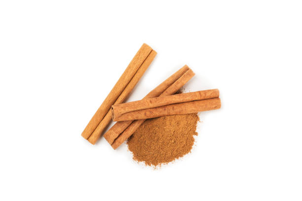 istock Cinnamon sticks on a textured wooden background. Cinnamon roll. Spicy spice for baking, desserts and drinks. Fragrant ground cinnamon. cinnamon powder Close-up. Place for text. copy space 2157736906