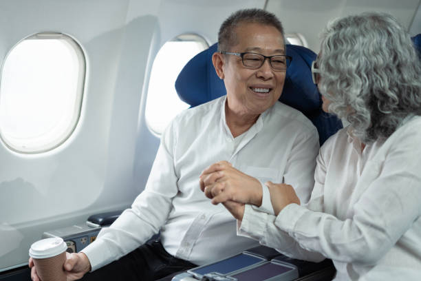 istock Mature couple sitting a private jet and headed on a trip. 2157738238