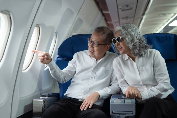 istock Mature couple sitting a private jet and headed on a trip. 2157738246