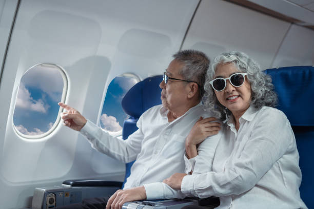 istock Mature couple sitting a private jet and headed on a trip. 2157738248