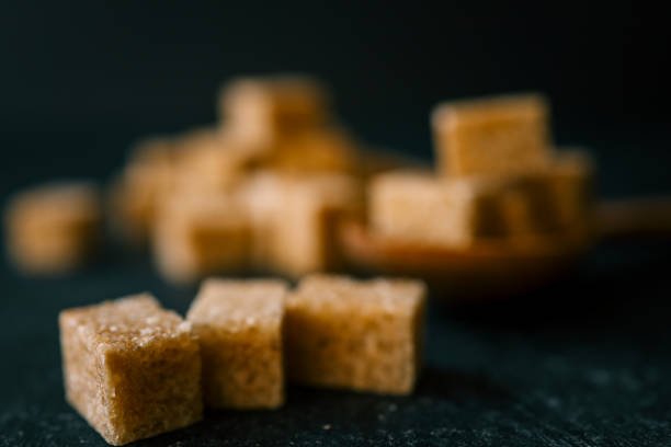 brown sugar heap and wooden spoon.