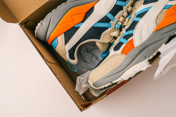 istock New men's sneakers in box on white background 2157739772