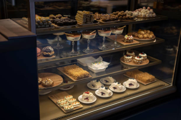 istock Array of Decadent Confections Displayed in a Candy Shop Window at Dusk 2157740001
