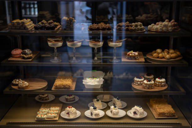 Array of Decadent Confections Displayed in a Candy Shop Window at Dusk