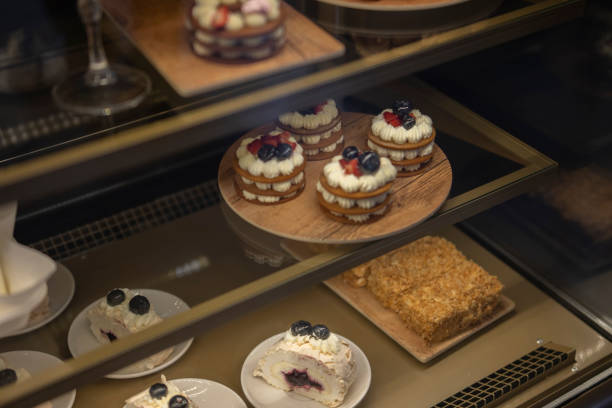 istock Array of Decadent Confections Displayed in a Candy Shop Window at Dusk 2157740023