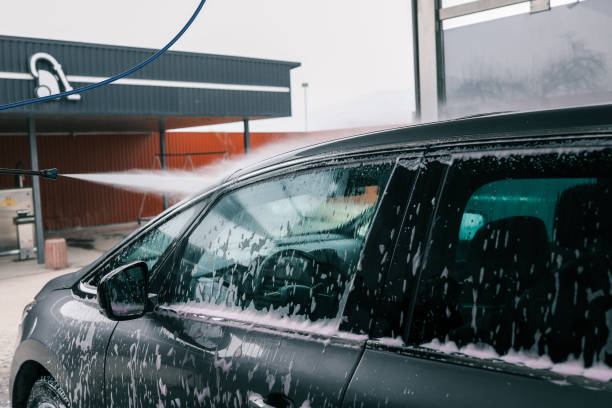 istock Car washing. Cleaning Car Using High Pressure Water 2157741417