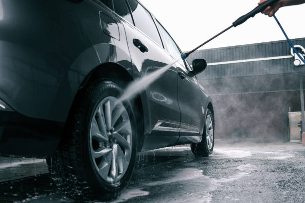 istock Car washing. Cleaning Car Using High Pressure Water 2157741419