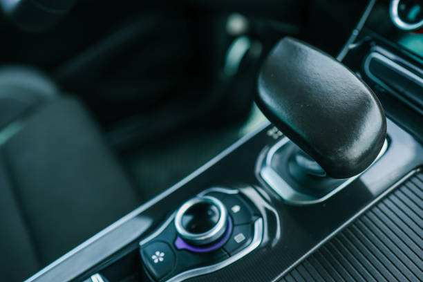 istock automatic transmission shift selector in the car interior. Closeup a manual shift of modern car gear shifter 2157741437