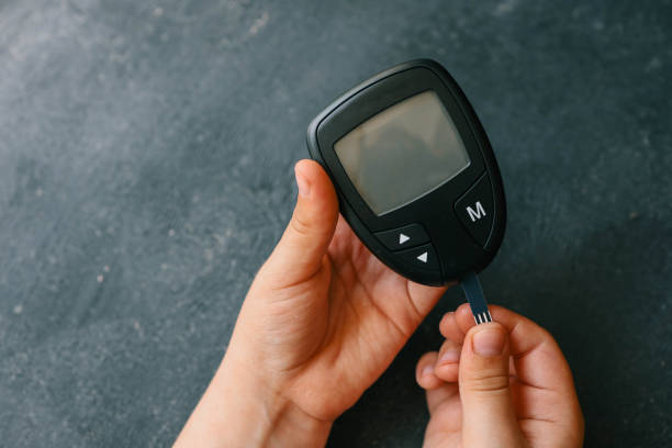 istock Close-up Of Woman Hands Testing High Blood Sugar With Glucometer 2157742829