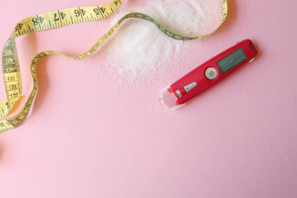 istock Sugar level measuring tool and measuring tape on table, weight loss concept 2157742852