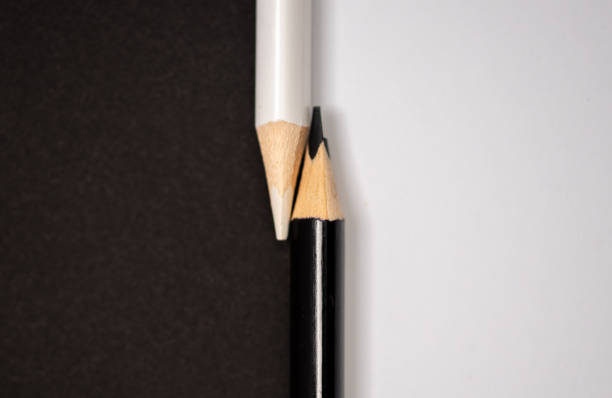 istock Black and white pencils isolated on white and black background, concept with black and white 2157743781