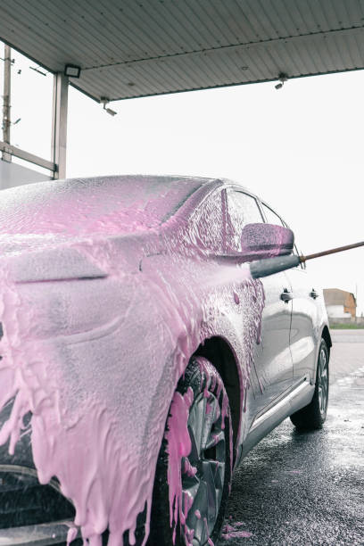 istock Hand washing car with pink foam, advertising 2157746629