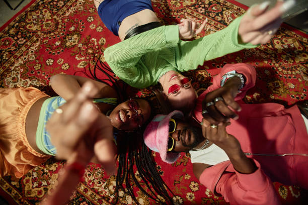 istock Young People Lying on Carpet in Circle 2157752133