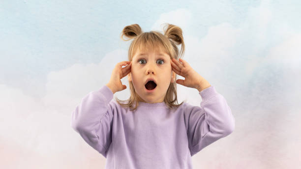 istock Stunned young lady clutches head in horror opening mouth 2157753521