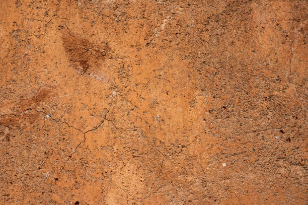 istock Full frame shot of an earthen wall texture of clay house structure. 2157762013