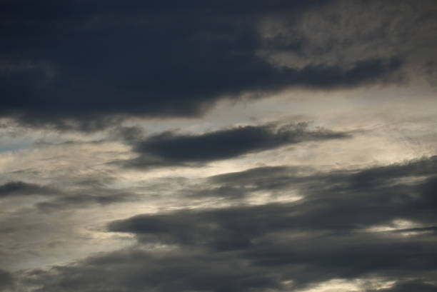 Dark clouds  gathering in the sky in sunset