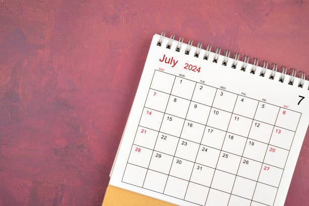 istock July 2024 desk calendar on red background. 2157764324