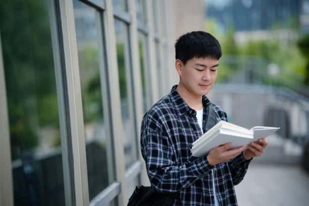istock Adult male student on university campus 2157766444