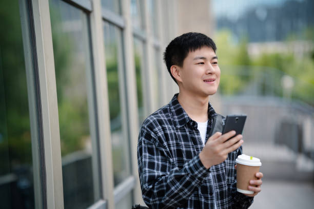 istock Adult male student on university campus 2157766488