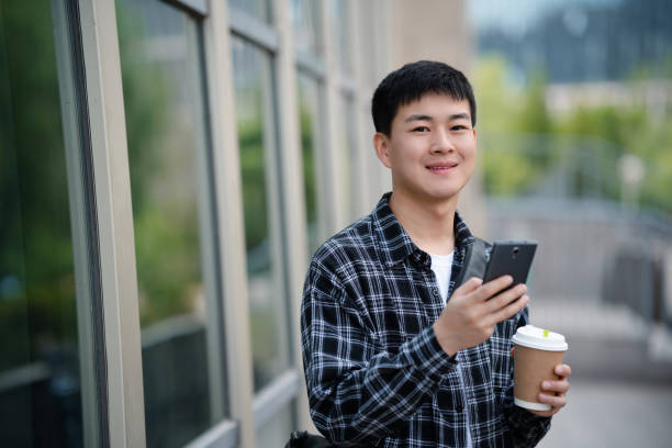 istock Adult male student on university campus 2157766501
