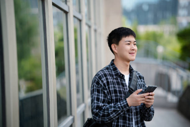istock Adult male student on university campus 2157766517