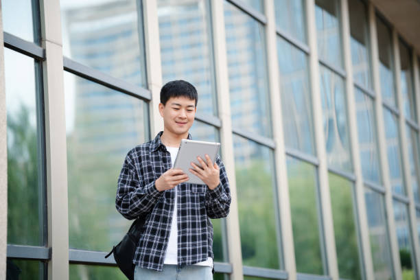 istock Adult male student on university campus 2157766561
