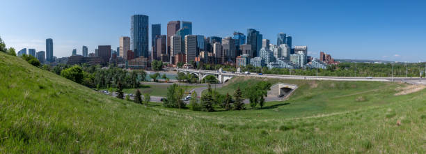 istock Panoramic city skyline in Calgary, Alberta during summer time with beautiful blue sky day Centre St Bridge in view. 2157770689