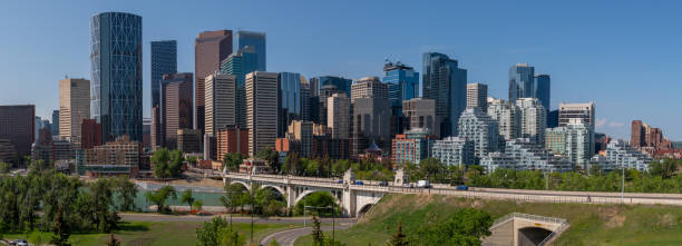 istock Panoramic city skyline in Calgary, Alberta during summer time with beautiful blue sky day Centre St Bridge in view. 2157770727