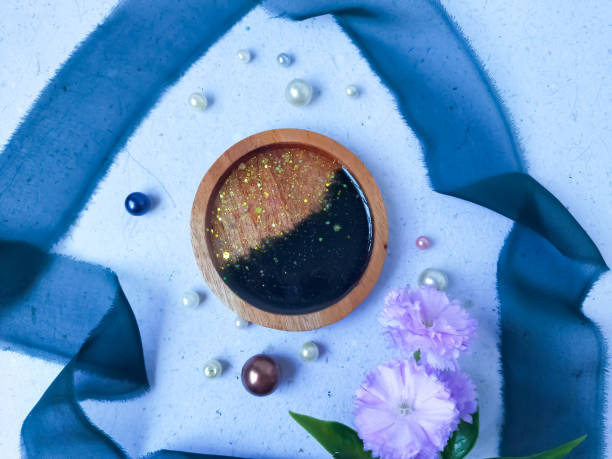 istock top view of handmade resin coasters on light background. Resin artwork. Craft. 2157776703