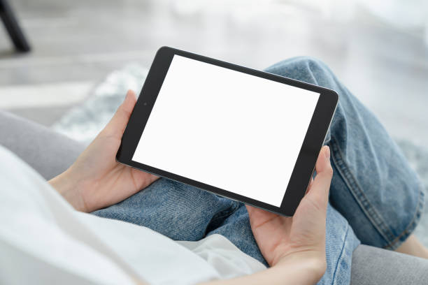 istock Hand holding digital tablet mockup of blank screen for graphic display montage. 2157779688