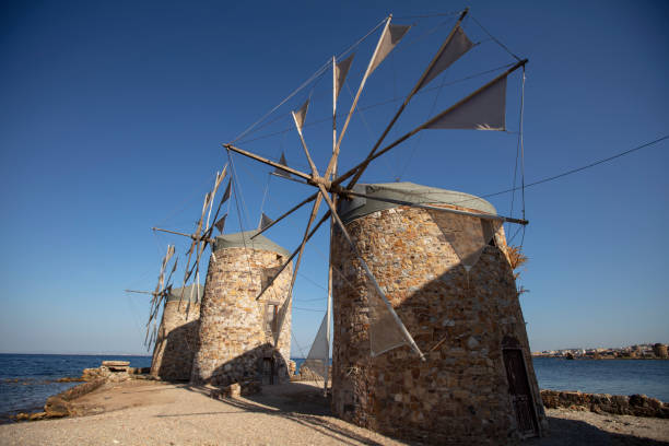 istock Old windmills by the beach, Chios island, Greece. 2157780443