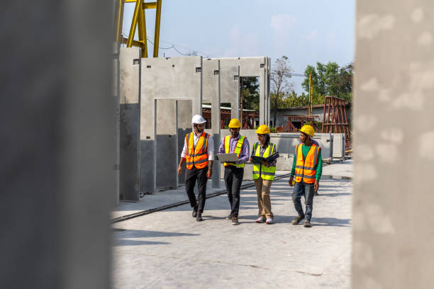 istock Foreman and workers in a construction factory 2157781588