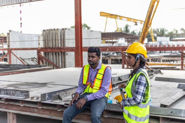 istock Foreman and workers in a construction factory 2157781594