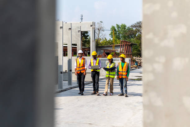 istock Foreman and workers in a construction factory 2157781601